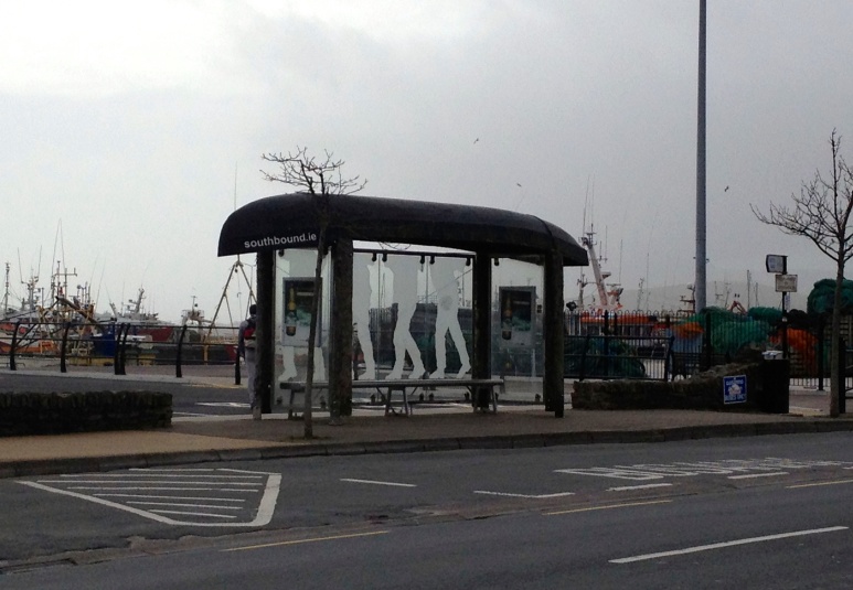 The bus stop is simply a traditional fishing boat on top of some poles.  