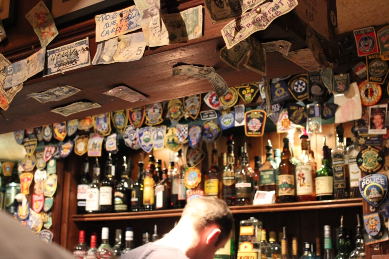 All of the bars we went to had various international money hung up everywhere, and this one in Galway also had police badges.  -PP to C 