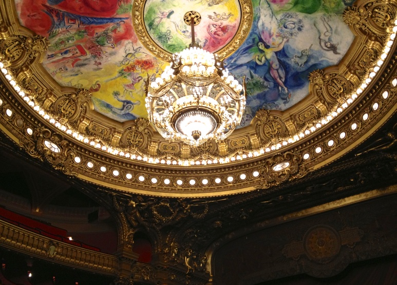 The Current Paris Opera House chandelier.  The painting on the ceiling changes and the past ceiling designs are on display in the Opera House.  