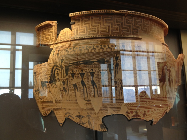 This is an Oriental style Greek pot.  You can tell because of the yellowish color, the exotic animals on the pot, and the crude depictions of human figures.  
