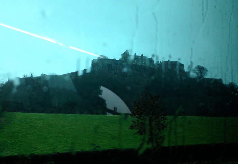 Sterling Castle out the rainy bus window - apologizes 